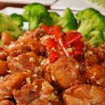 Easy General Tso Chicken with broccoli on a white plate