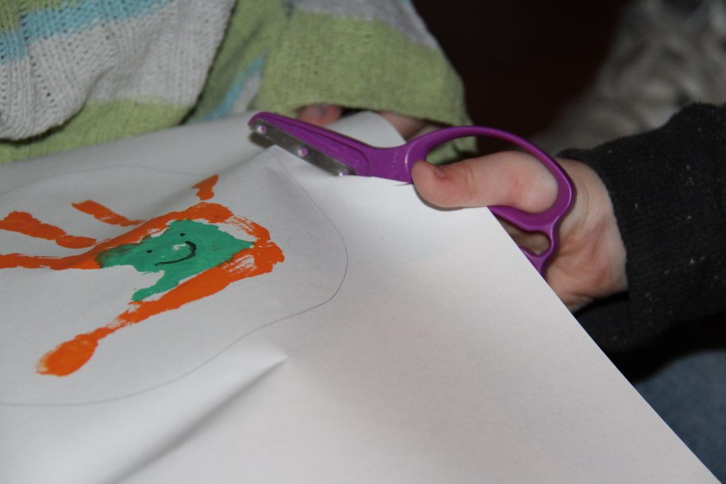 Create a simple handprint Leprechaun craft for kids. It is a perfect last minute St. Patrick's Day craft for kids that they will have fun playing with.