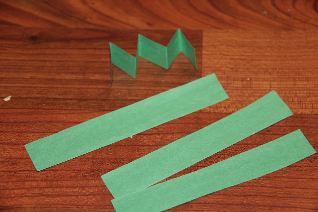 Create a simple handprint Leprechaun craft for kids. It is a perfect last minute St. Patrick's Day craft for kids that they will have fun playing with.