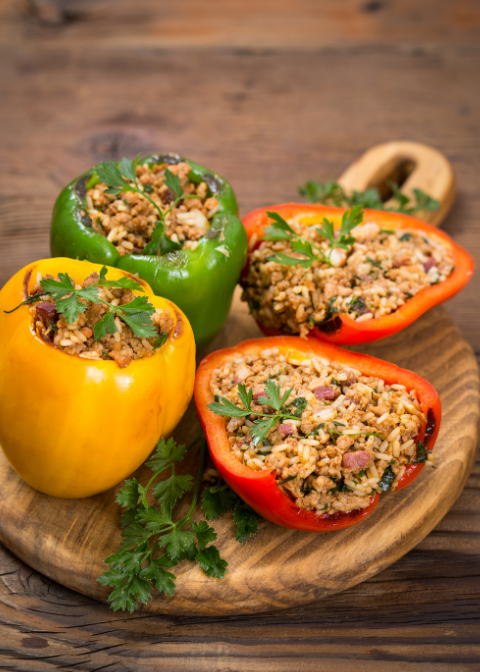 healthy stuffed peppers on a cutting board