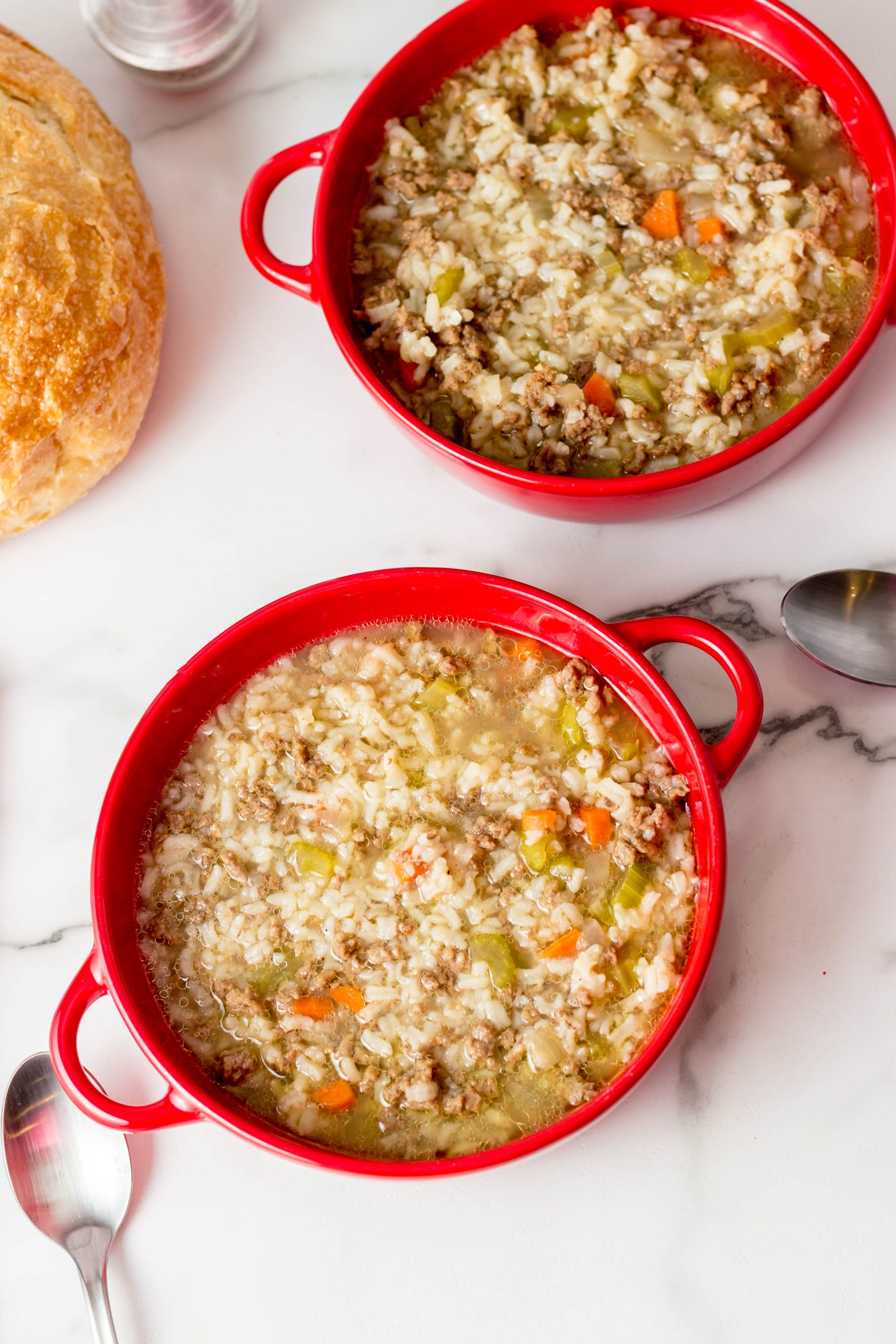 beef rice soup in a red bowl