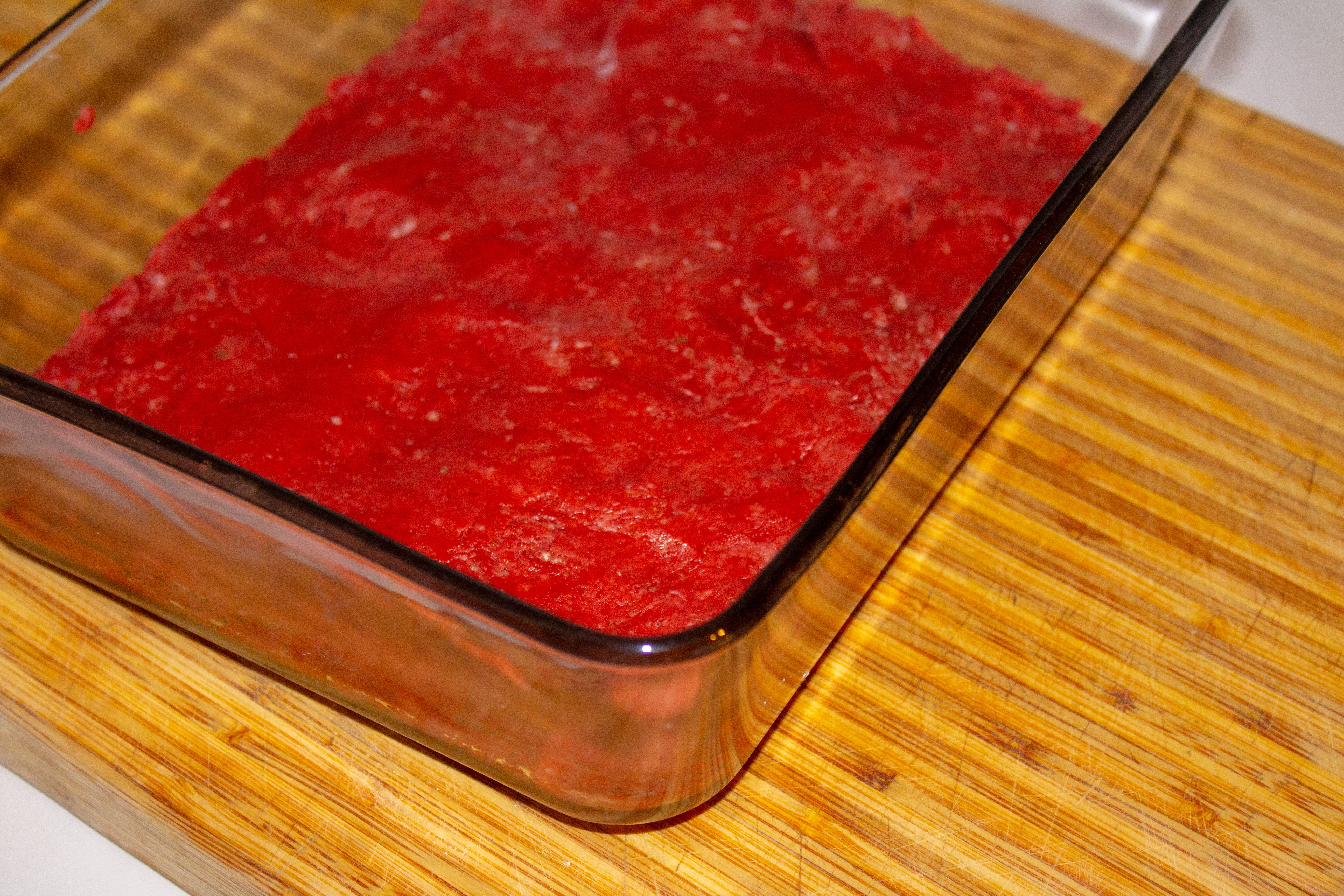 red velvet cake batter fudge in a pan