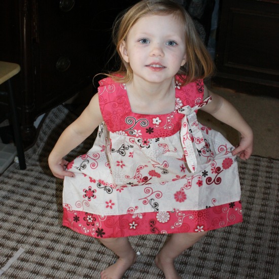 Willow doing a curtsy in her new outfit- matching girl doll clothes