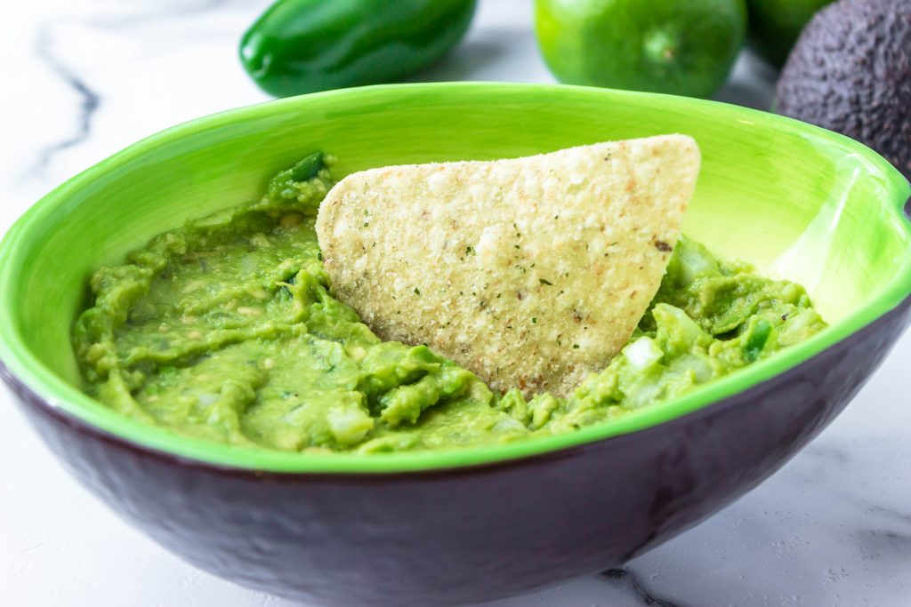 guacamole recipe in a green bowl
