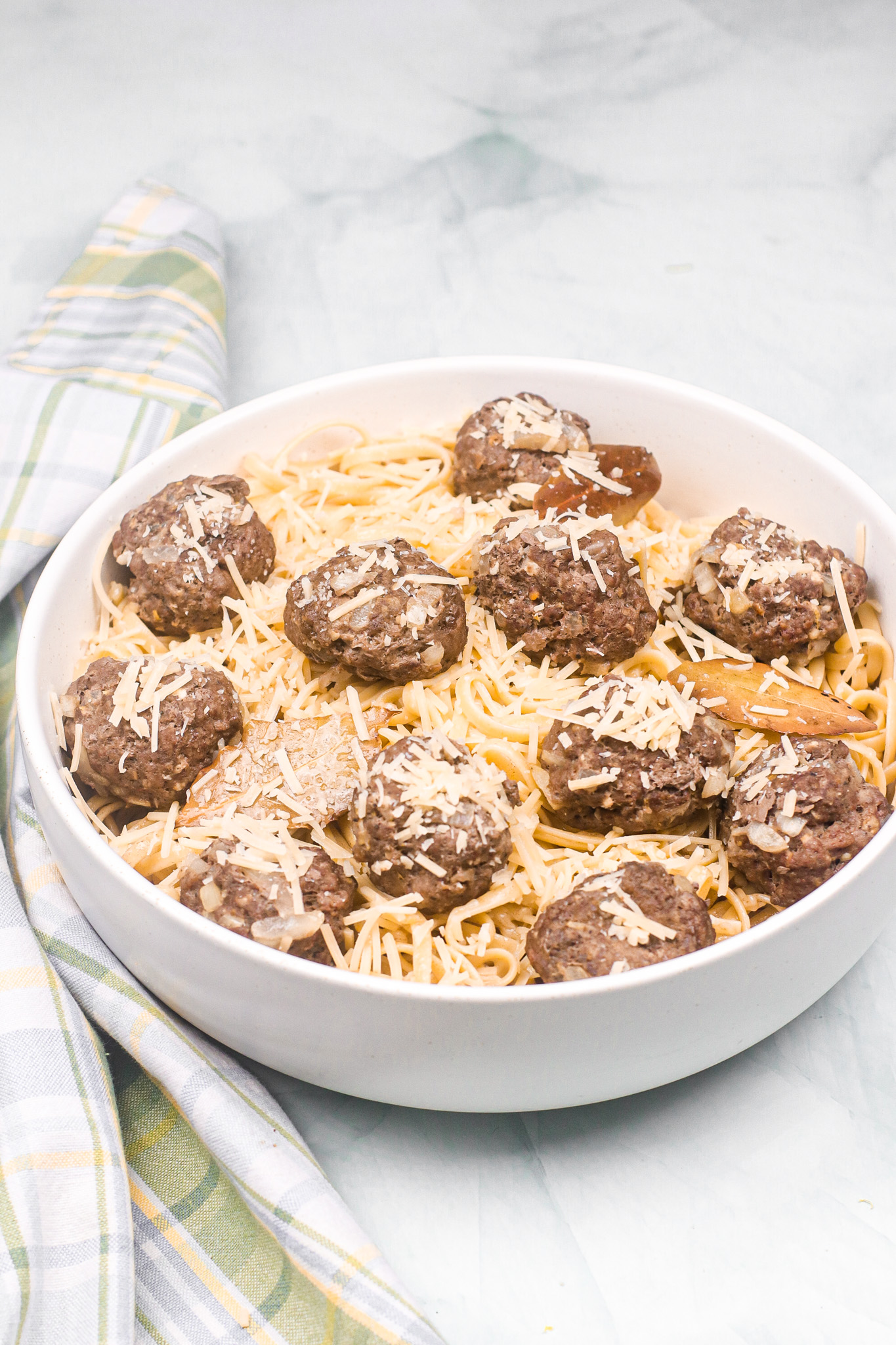 lemon sage pasta with meatballs in a white bowl