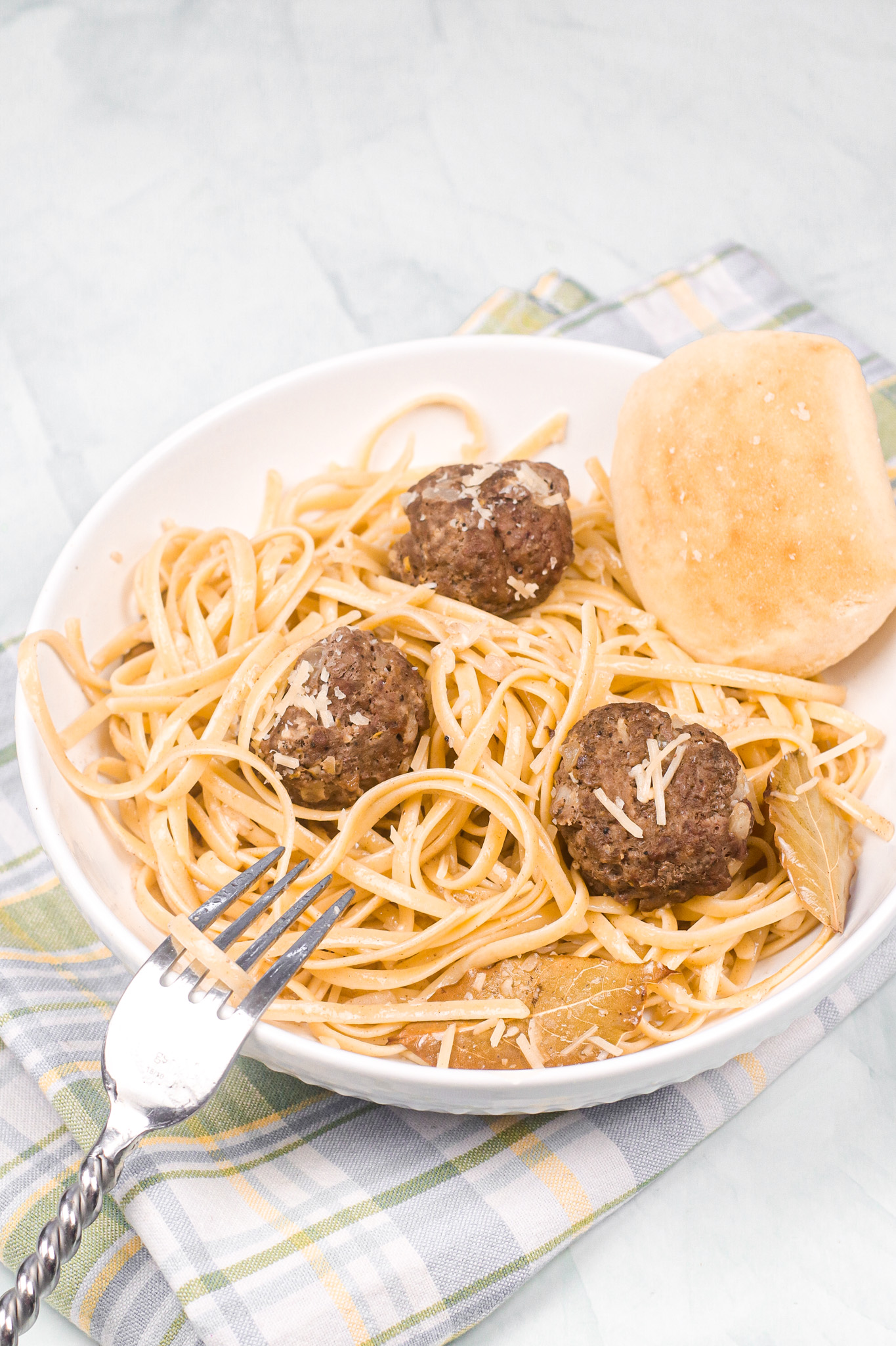 lemon sage pasta with meatballs in a white bowl