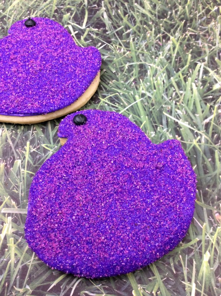 peep cookies with purple sanding sugar on top
