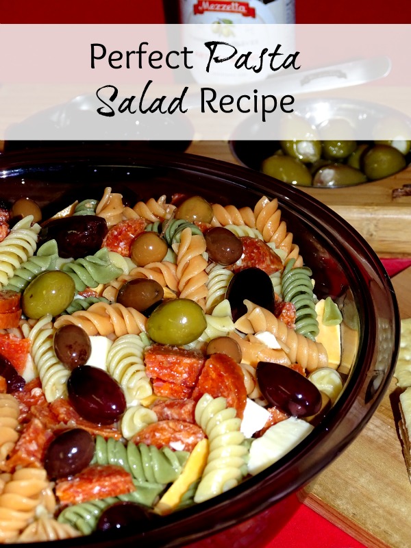Looking for a picnic recipe that everyone will love? This potluck pasta salad recipe is perfect for an easy dinner recipe, or for a get together.