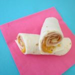 Looking for a simple back to school lunch idea that can be made in no time. Ham and Cheese Roll Ups are perfect for a quick lunch idea.