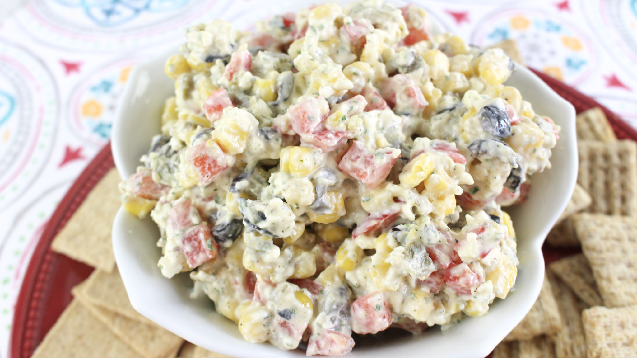 Fiesta Ranch Dip - Looking for a fiesta ranch dip? This Ranch Fiesta Dip is a delicious recipe that is perfect for a potluck or get together. This Ranch Fiesta Dip recipe is perfect for any time. It is addictive and delicious and will be a hit. 