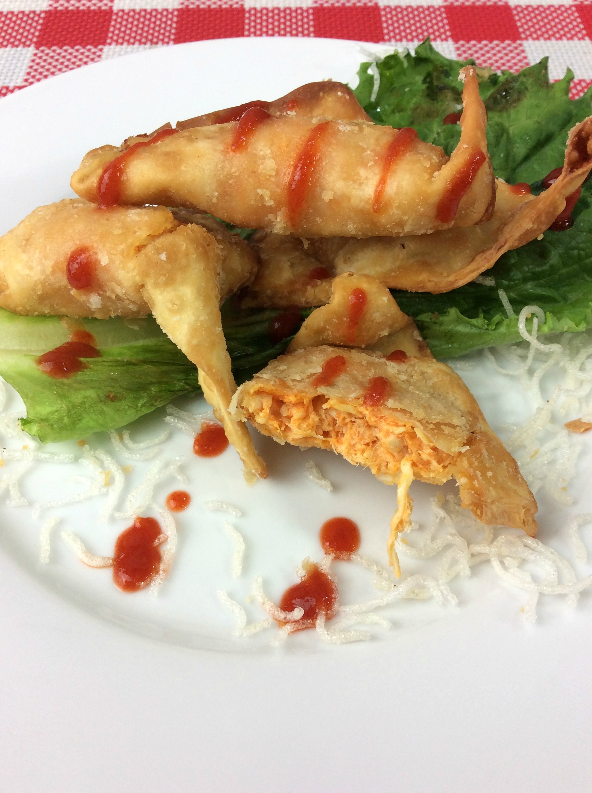The Cheesecake Factory Buffalo Blasts copycat recipe is filled with Chicken, Cheese and Spicy Buffalo Sauce in a fried wonton wrapper. It is fried to add the perfect amount of crunch.