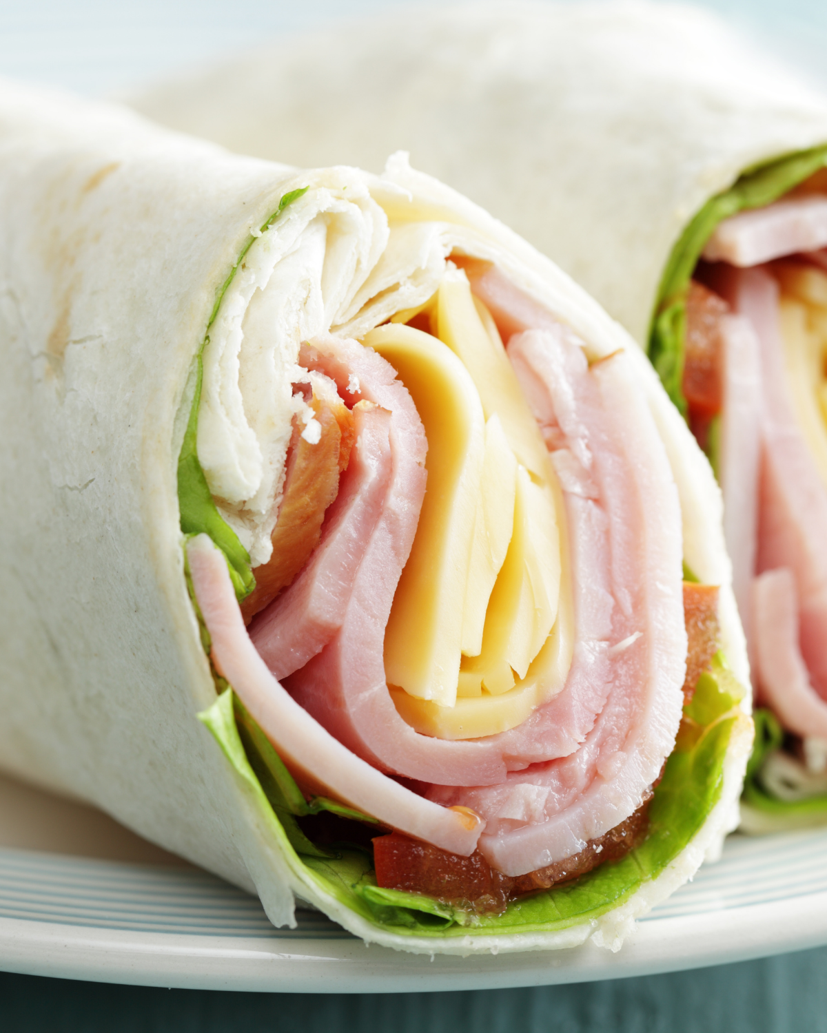 ham and cheese roll up on a tortilla