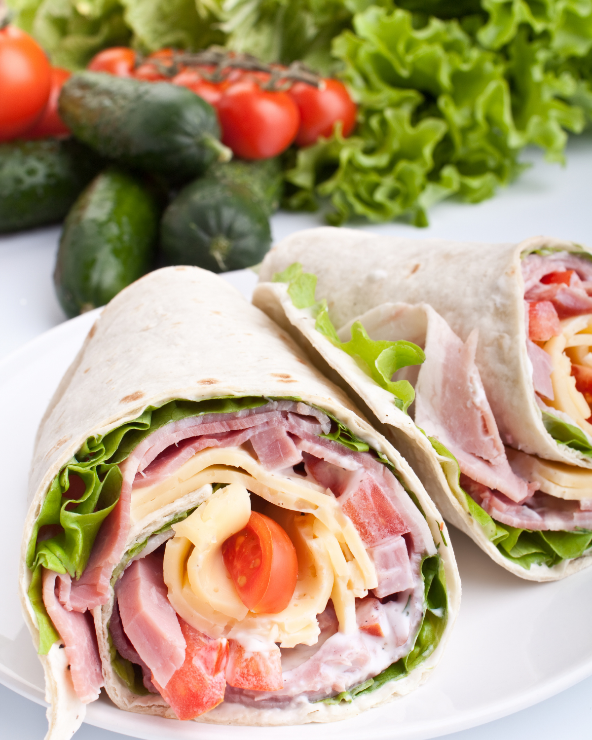 ham and cheese roll up on a tortilla