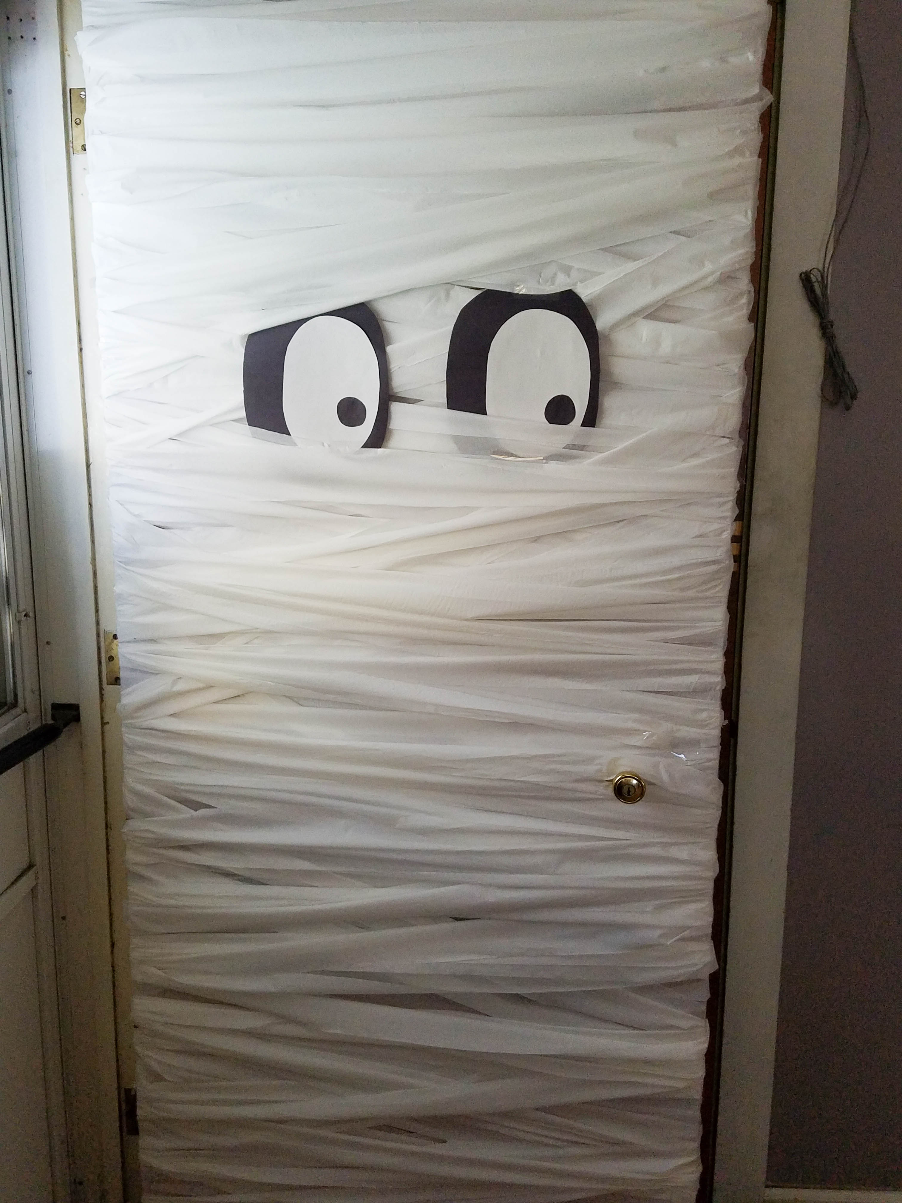 Create A Diy Mummy Halloween Door Decoration