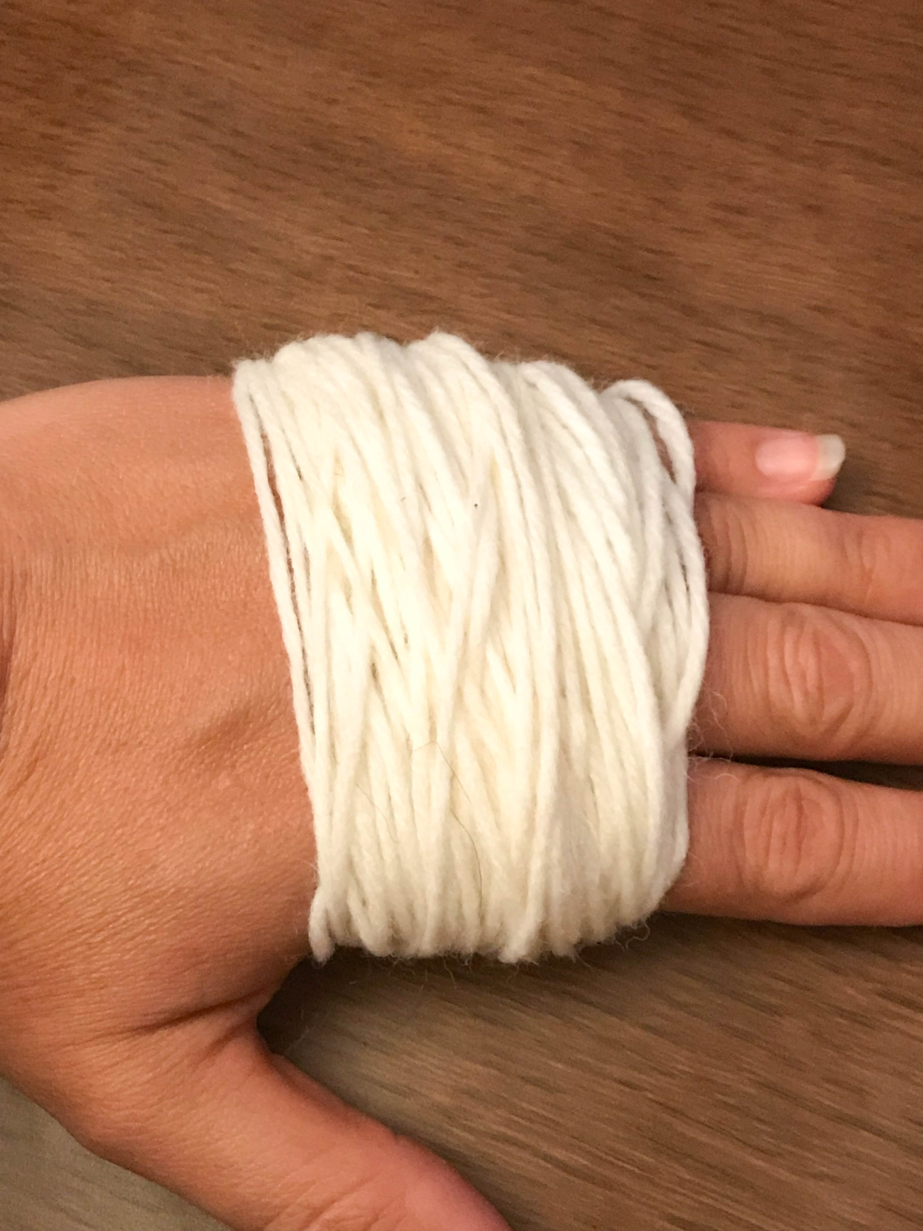 yarn wrapped around a hand