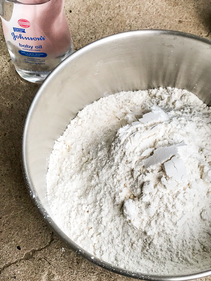 It is so simple to make your own moon sand. With only 2 household ingredients, save a fortune and lets the kids play with moon sand.