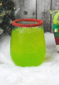 Green Christmas drink with red sanding sugar, Grinch Cocktail