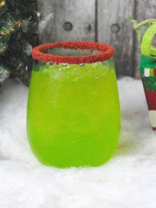Green Christmas drink with red sanding sugar, Grinch Cocktail