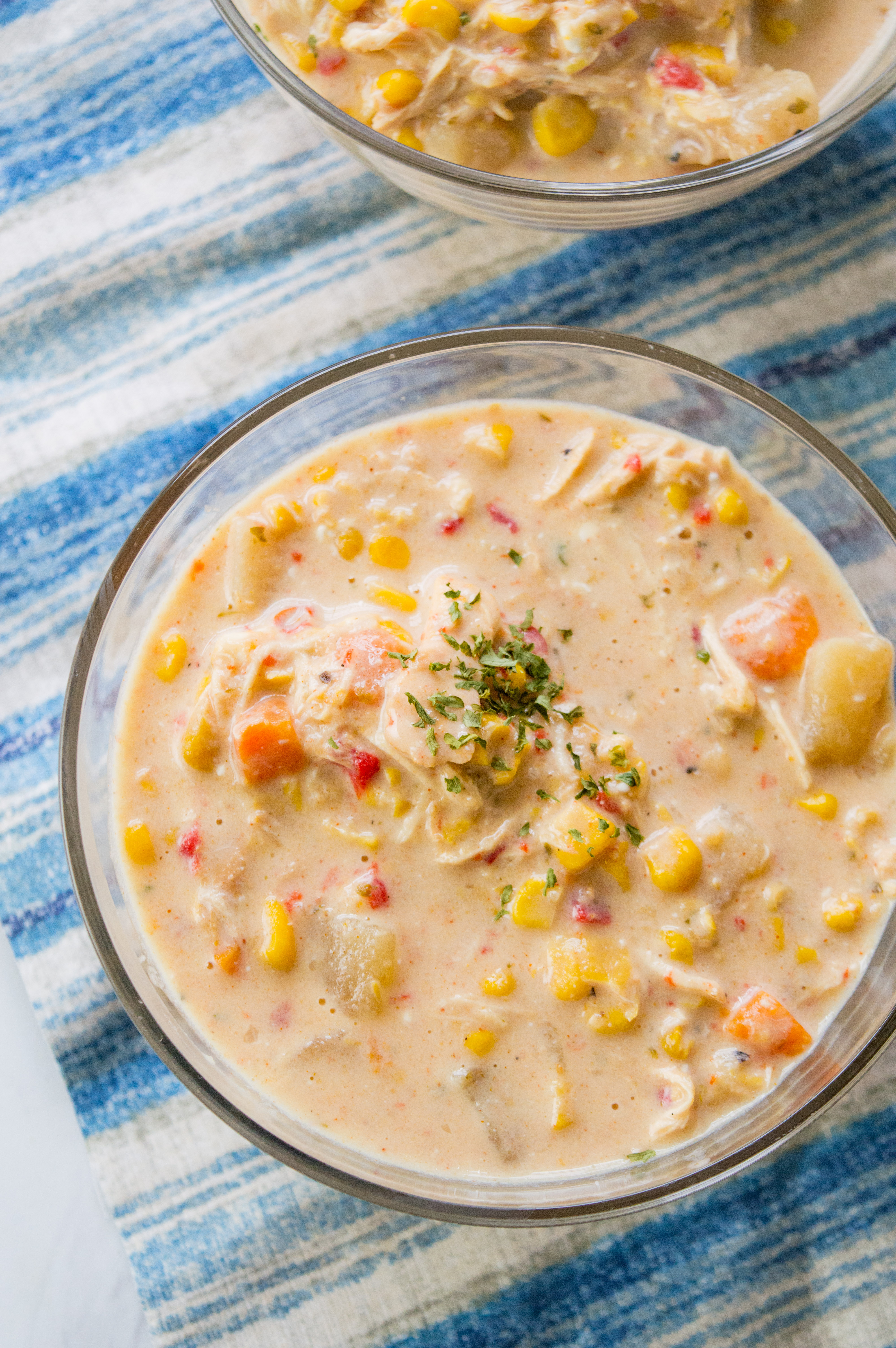 Looking for a chicken corn chowder recipe? This slow cooker soup is a copy cat recipe of WAWAs chicken corn chowder and it is soup heaven. 