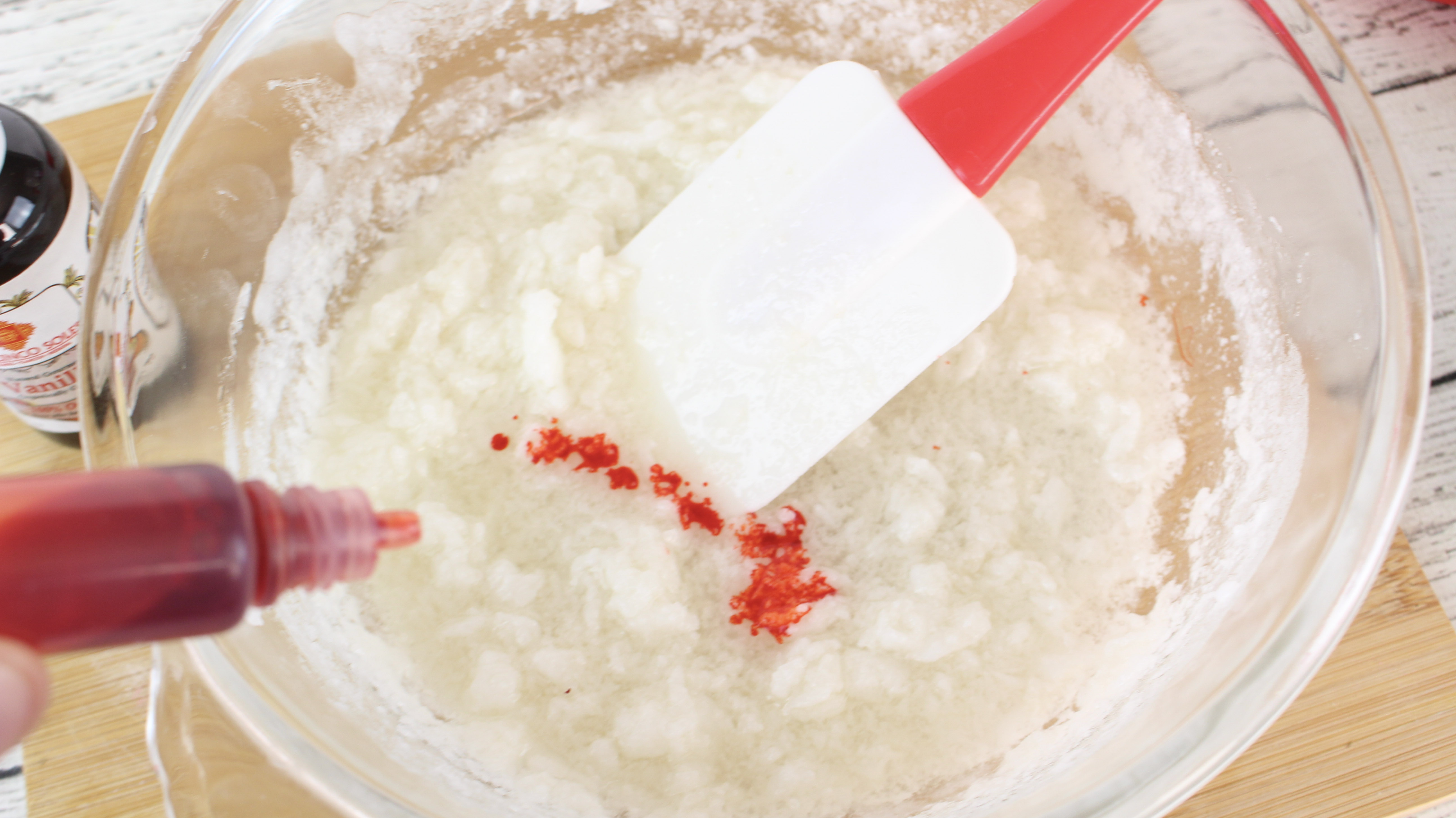 Add the coloring to the mixture to make Rose Vanilla Exfoliating Sugar Scrub Soap Cubes