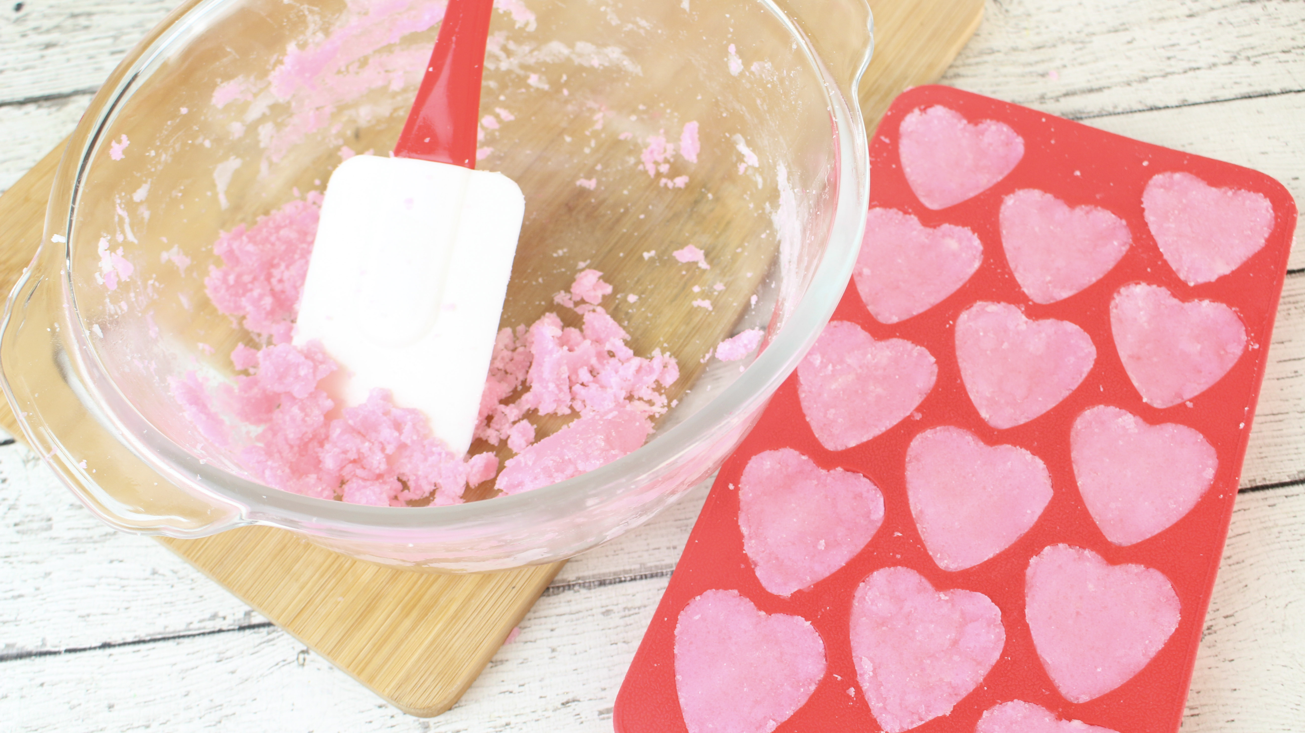 Add the sugar mixture into the molds to make Rose Vanilla Exfoliating Sugar Scrub Soap Cubes