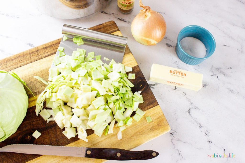 Sliced cabbage on a wooden cutting board