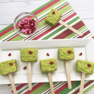 Looking for a fun Grinch treat? These simple to make Grinch Pops, which are Grinch Rice Crispy Treats will be a hit whether you make them for the kids, for a party or for a get-together. I think even the Grinch's heart would grow with these easy Christmas treats.