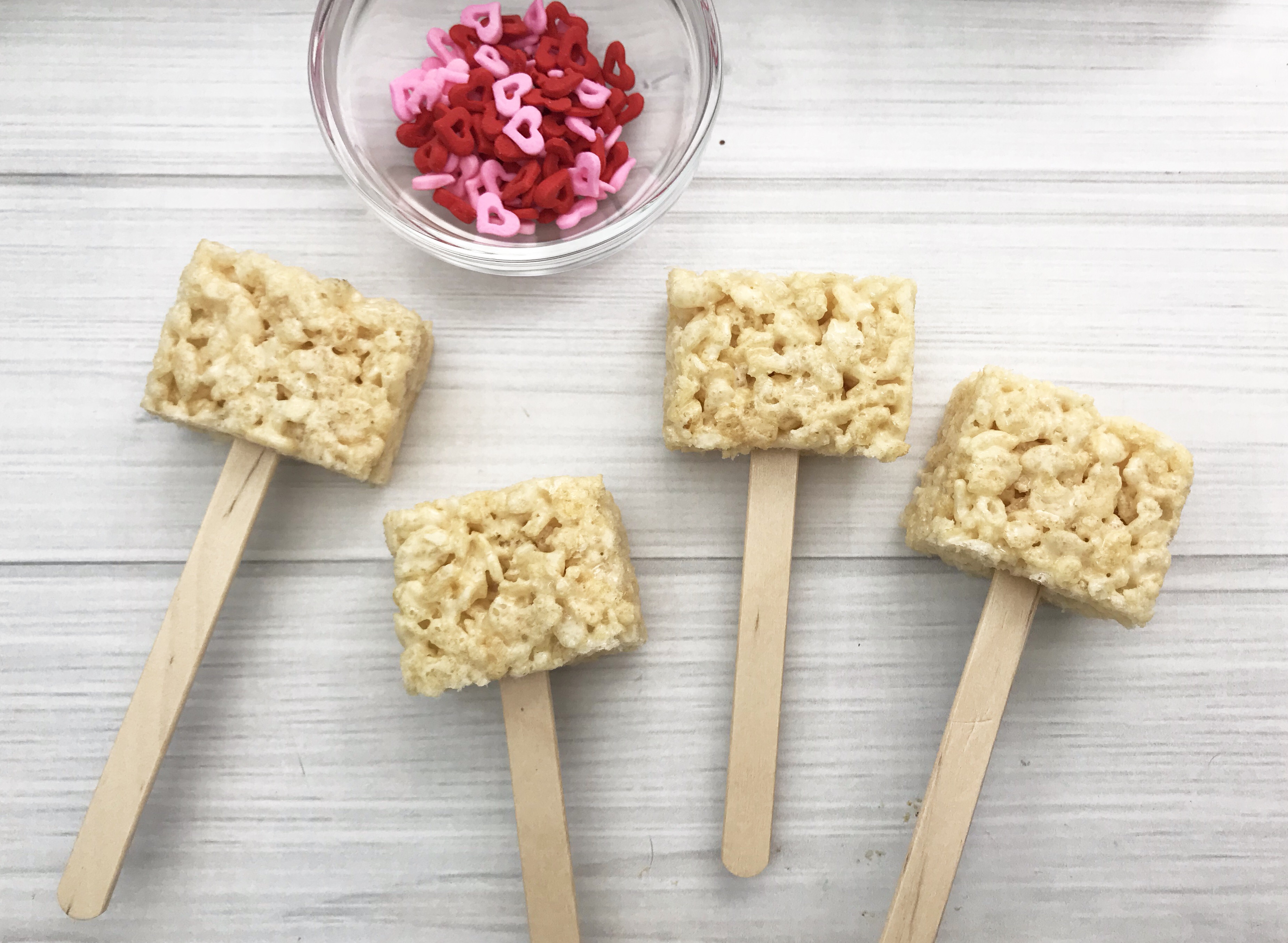 Looking for a fun Grinch treat? These simple to make Grinch Pops, which are Grinch Rice Crispy Treats will be a hit whether you make them for the kids, for a party or for a get-together. I think even the Grinch's heart would grow with these easy Christmas treats.