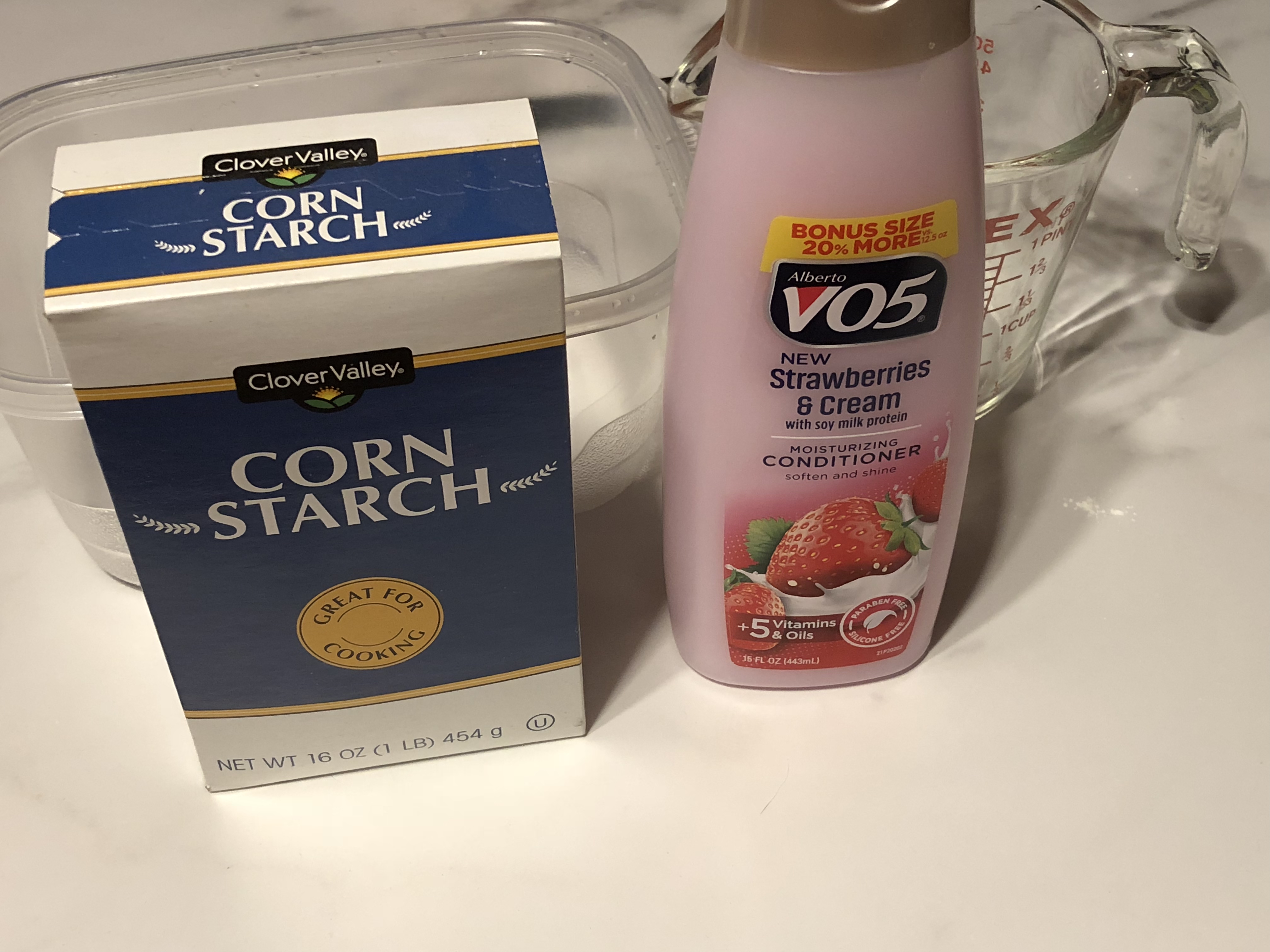 conditioner and cornstarch on a table
