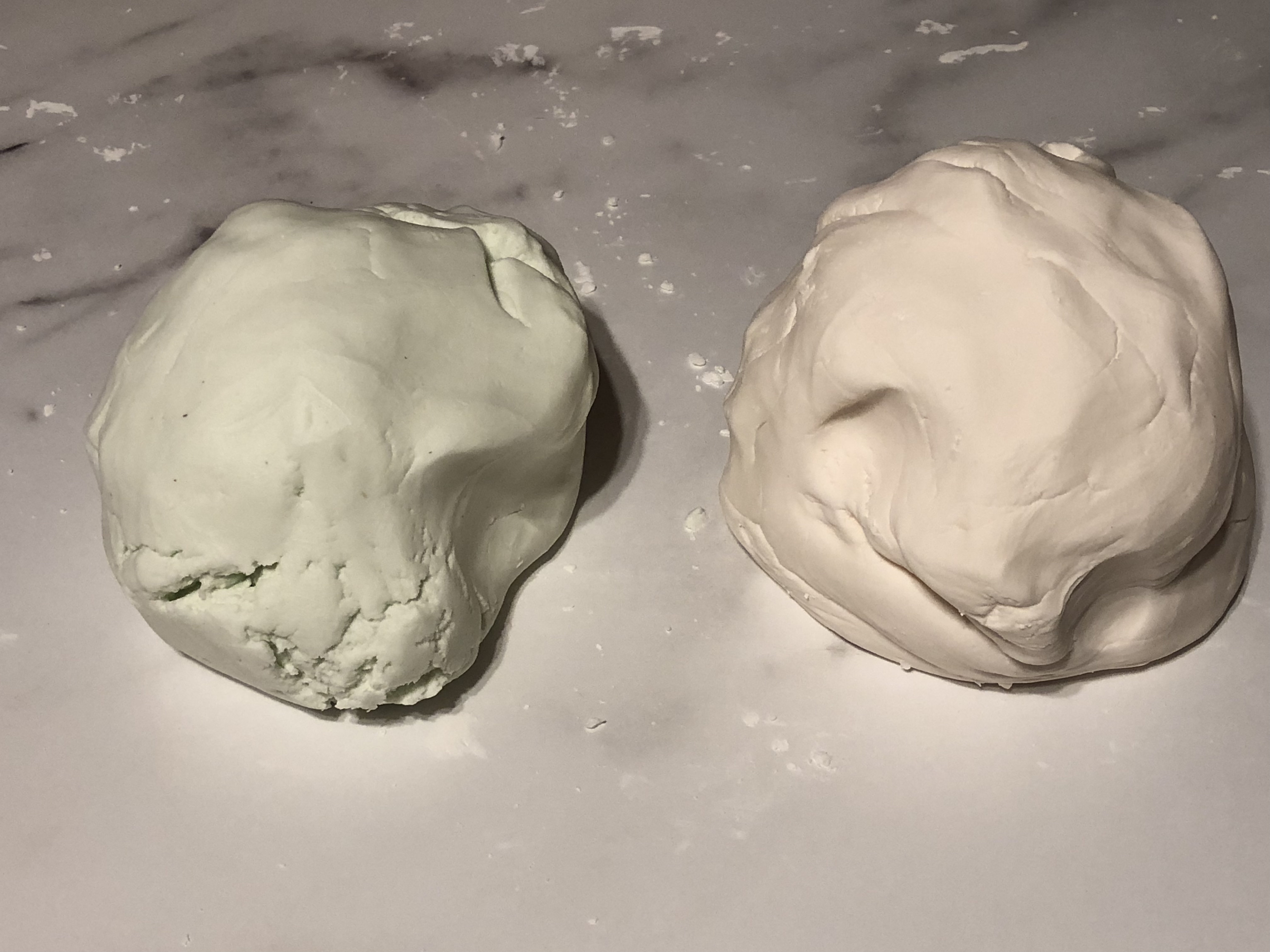 2 balls of play dough on a table