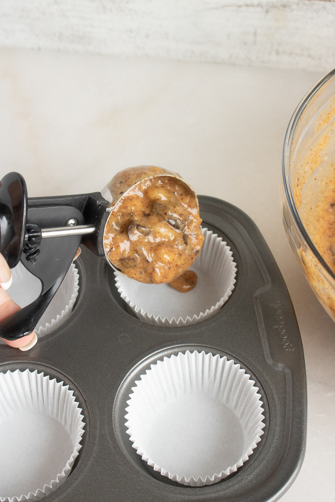 scoop the banana chocolate chip muffins into pans