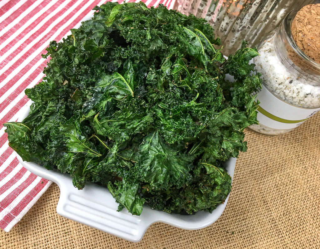Crispy Kale Chips are healthier than potato chips and for someone eating a low calorie, following Weight Watchers, low carb or keto diet, Kale Chips are great for having a crunchy go-to snack. Try this easy recipe for tasty kale chips. These tasty Kale chips are only 1 Weight Watcher point. 
