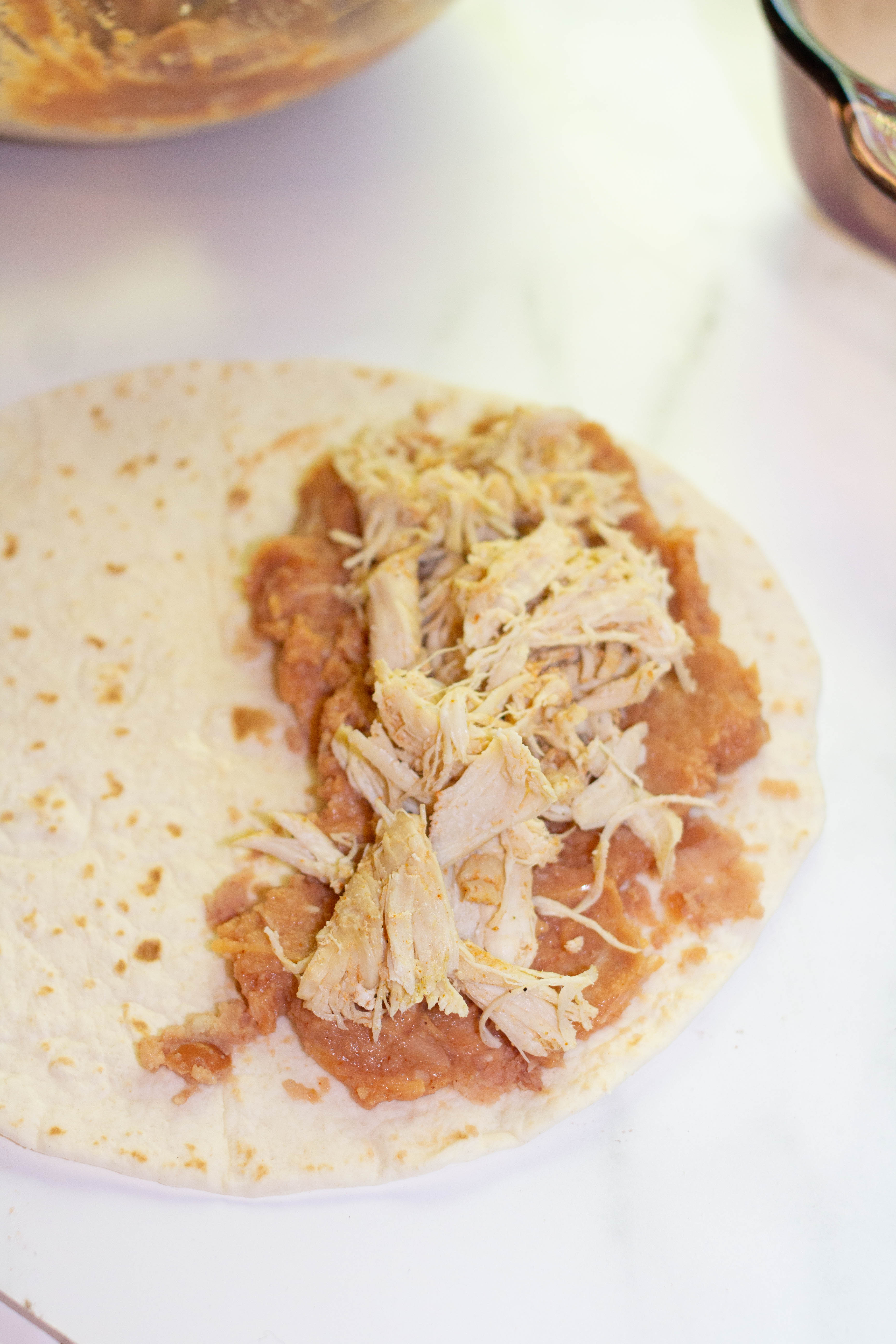 chicken and filling on a tortilla