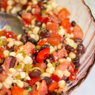 My Cowboy Caviar recipe is a genuinely delicious easy dip that can is made in less than 15 minutes. Cowboy Caviar is a perfect dish to bring to a picnic, potluck or family get together.