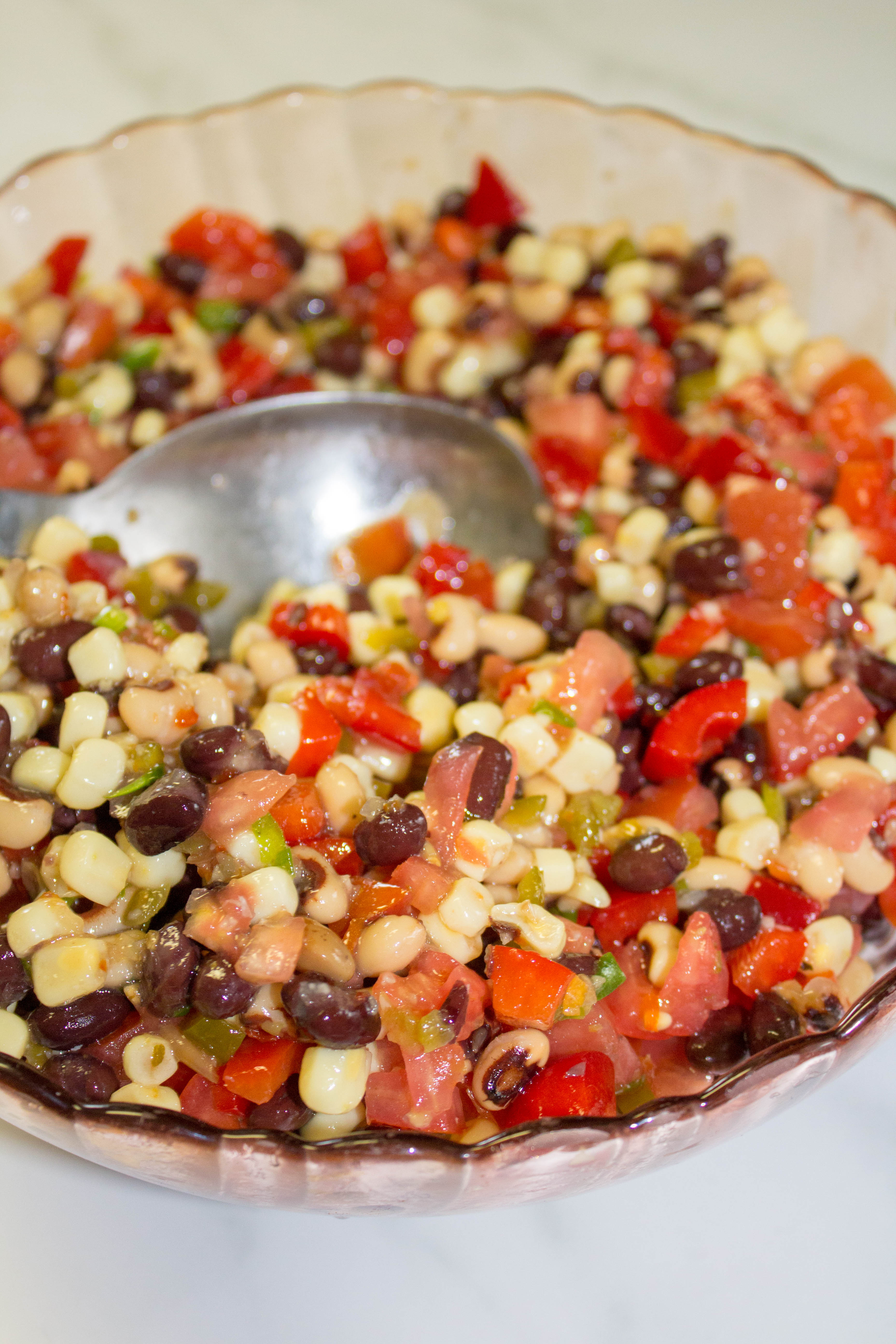 My Cowboy Caviar recipe is a genuinely delicious easy dip that can is made in less than 15 minutes. Cowboy Caviar is a perfect dish to bring to a picnic, potluck or family get together.