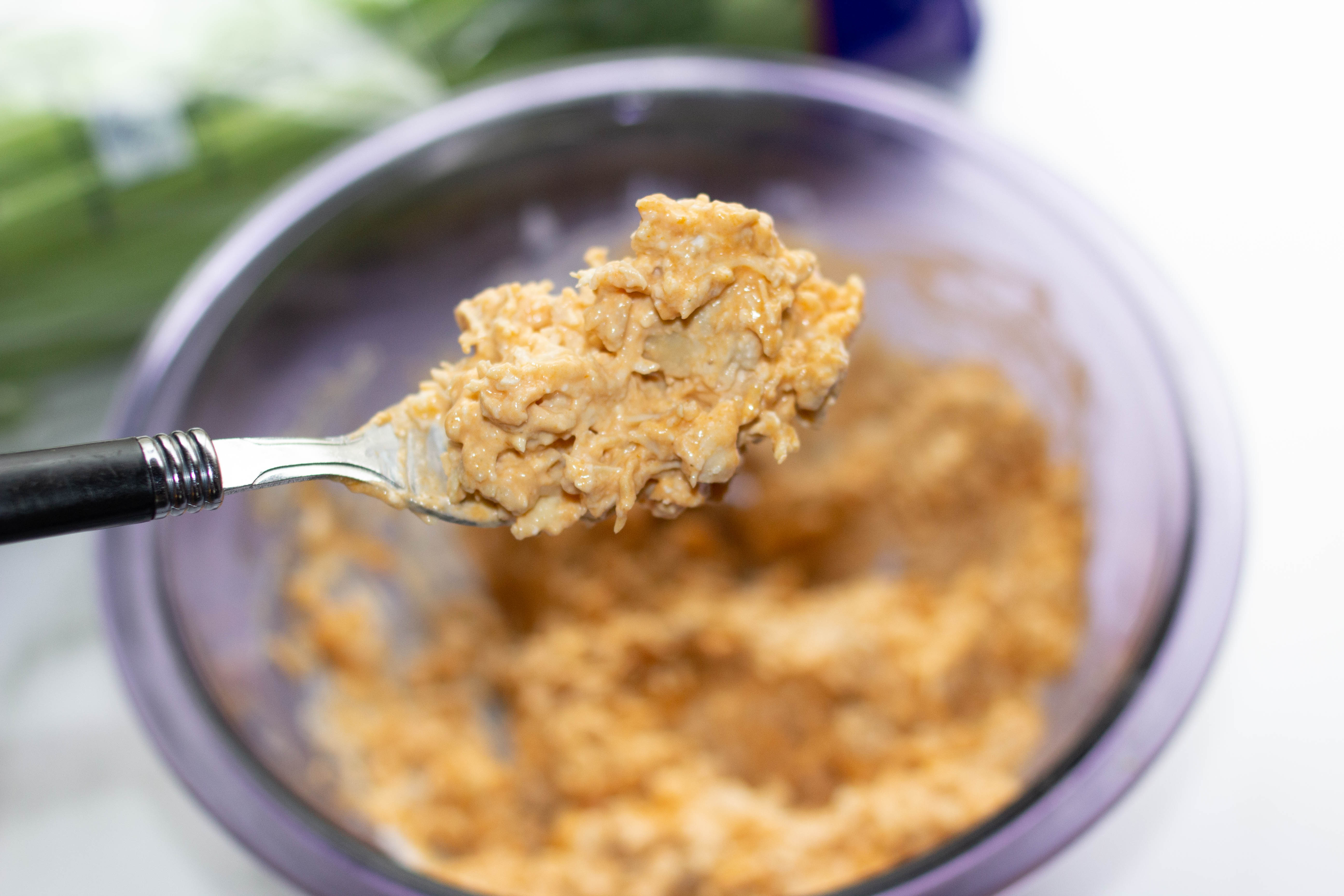 Healthy Buffalo chicken dip on a fork