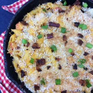 shrimp mac and cheese in a skillet