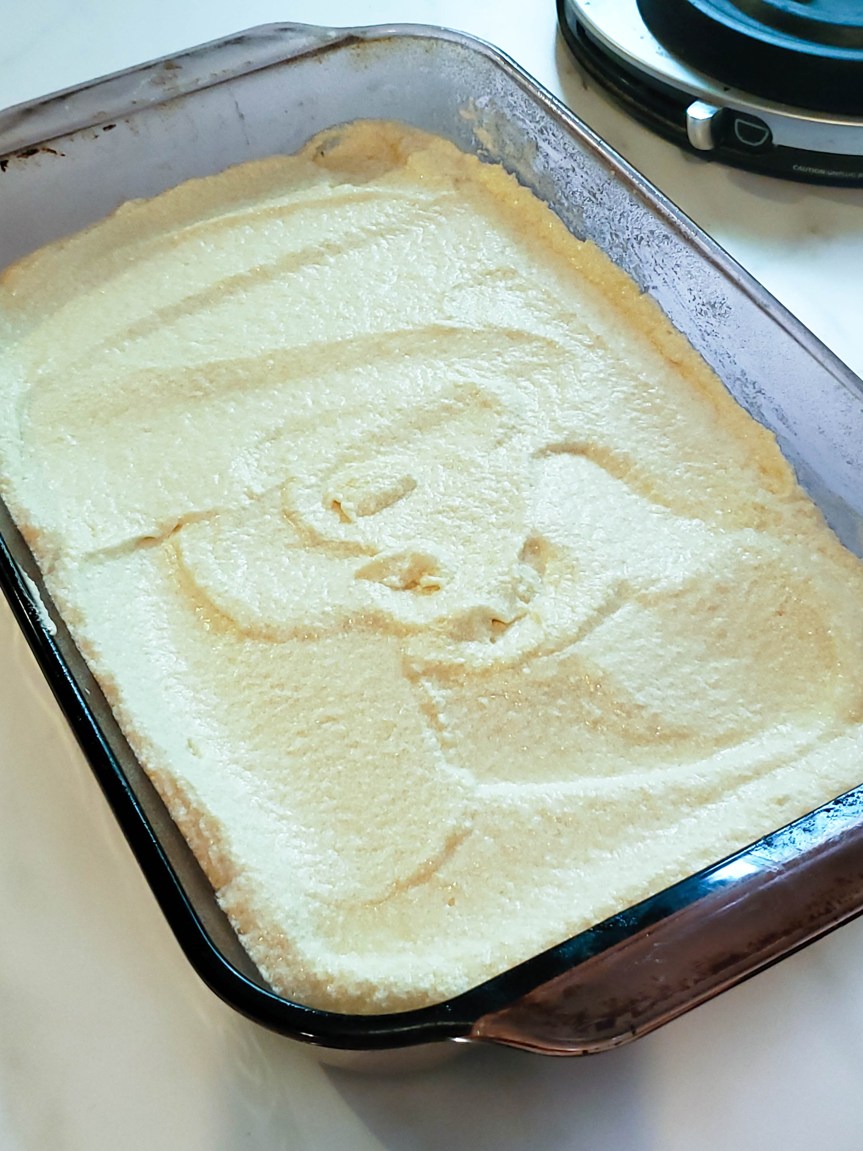 lemon cake batter in a cake pan
