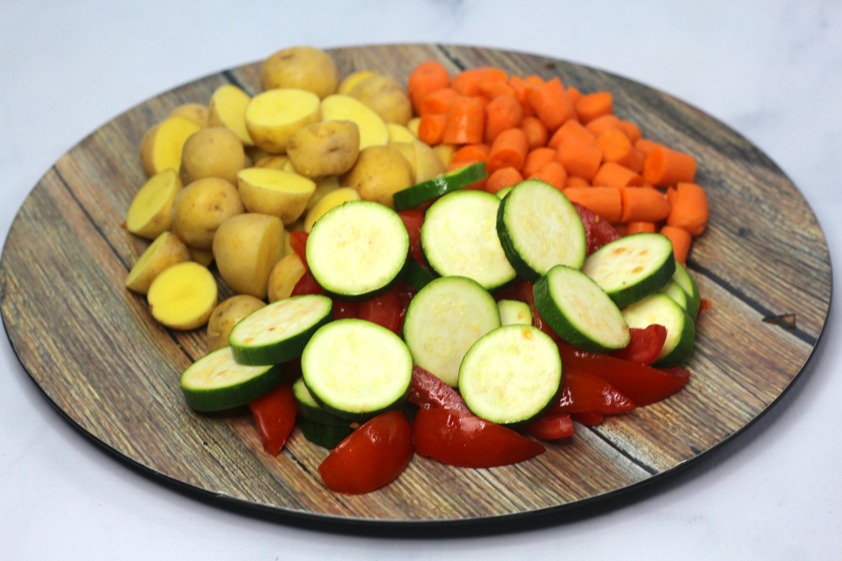 cut vegetables on a cutting board for best roasted vegetables ever