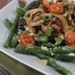 parmesan green beans on a white plate