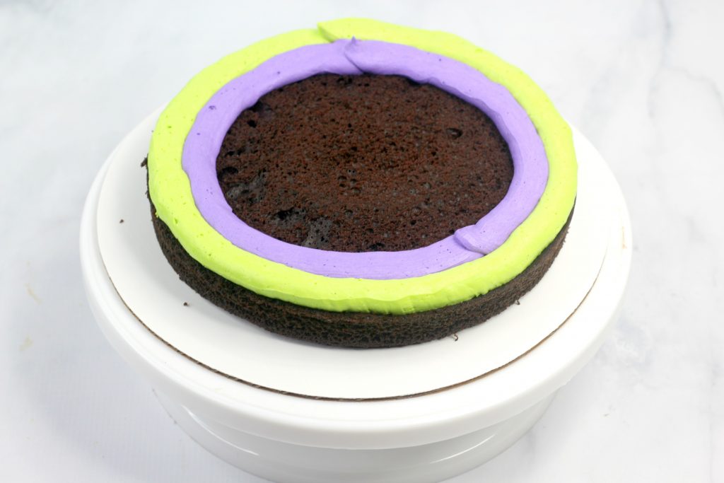 chocolate cake with green and purple frosting