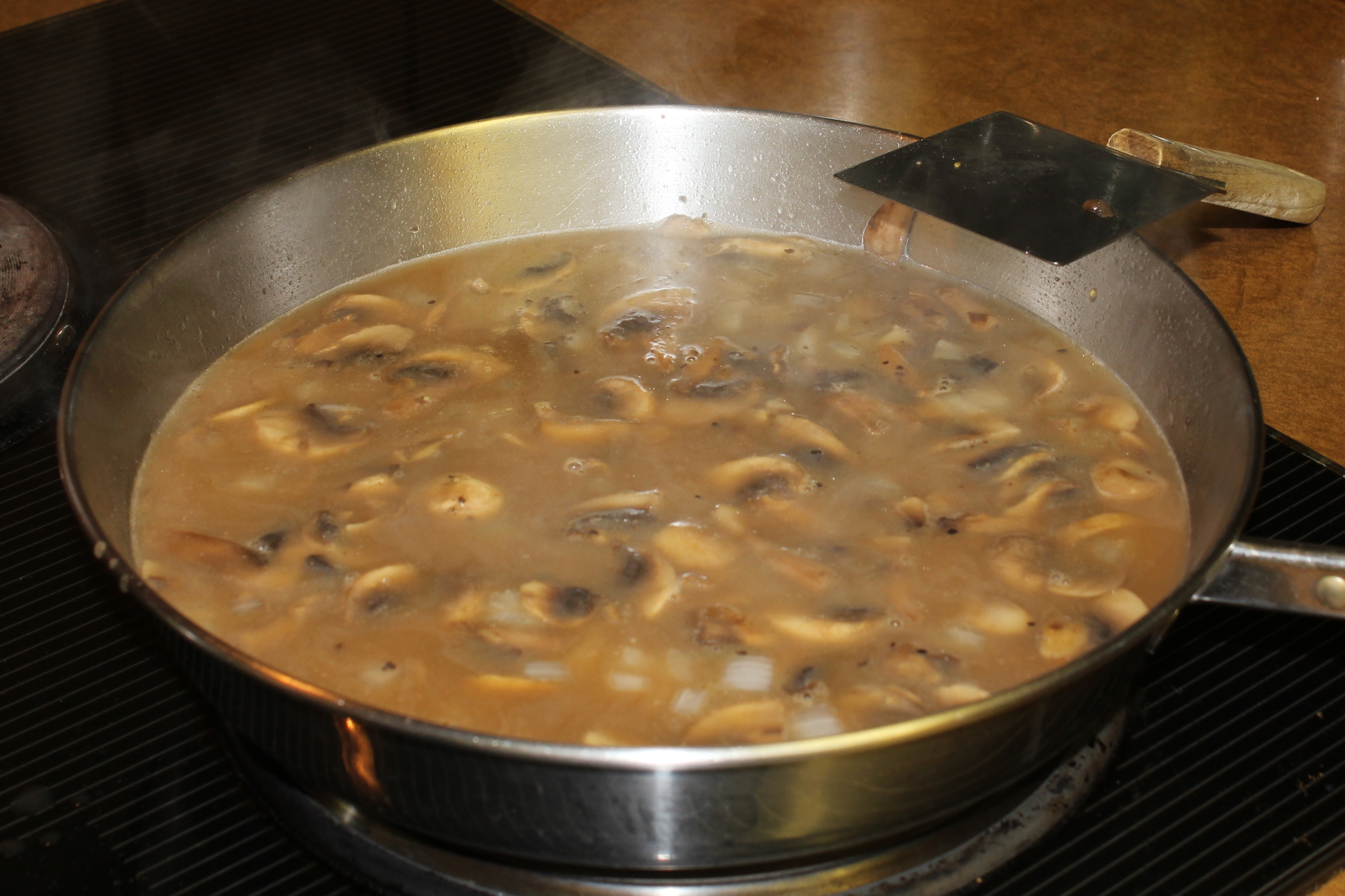 mushrooms cooking in keto gravy