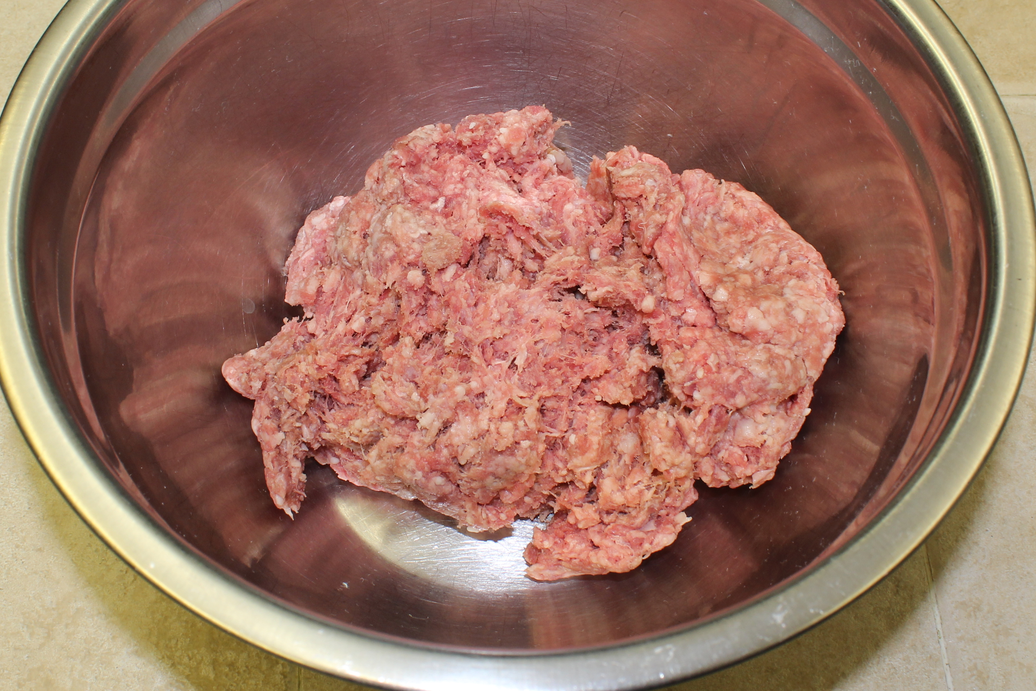 sausage and ground beef in a bowl