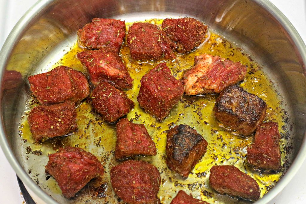 cooking steak bites in a pan