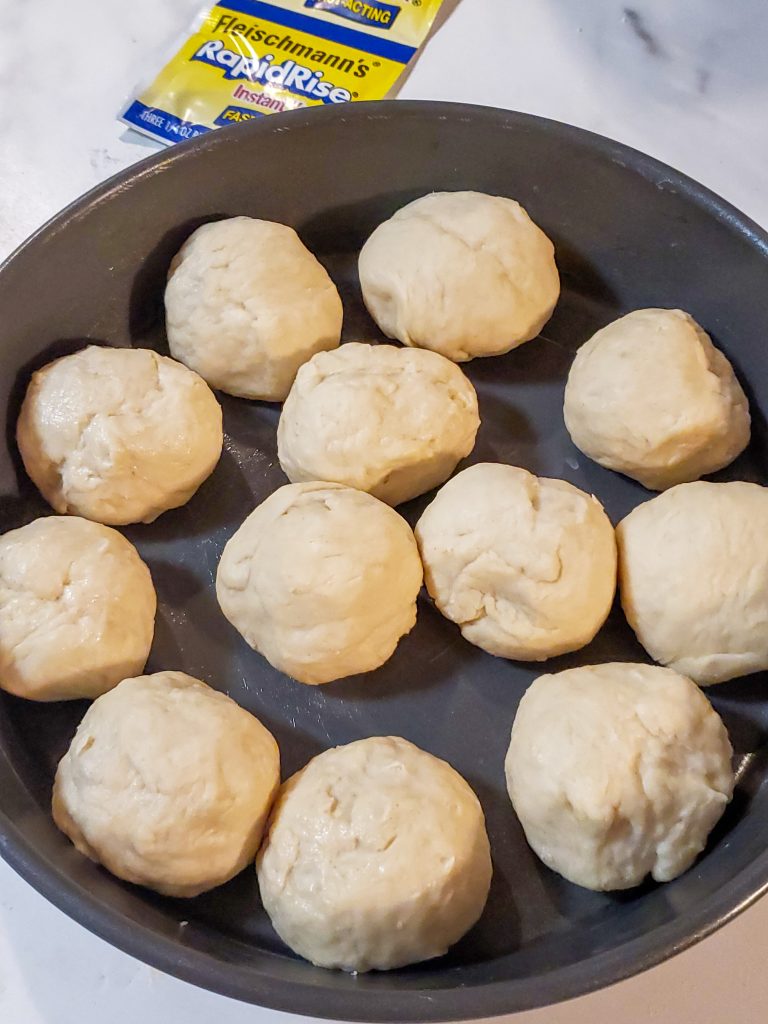 homemade rolls dough balls in a pan