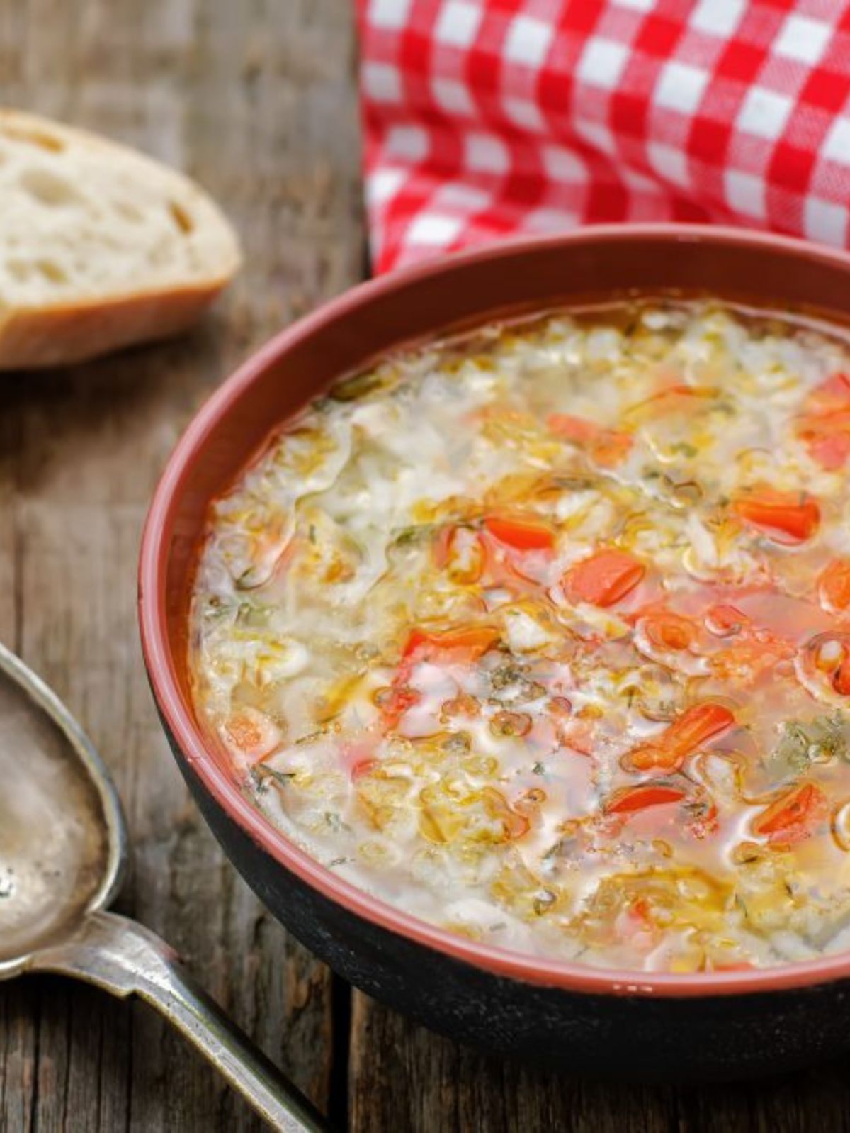 turkey and vegetables soup in a brown bowl
