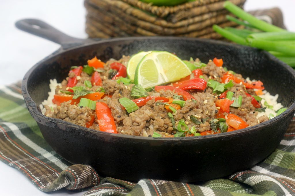 thai basil beef in a cast iron skiller
