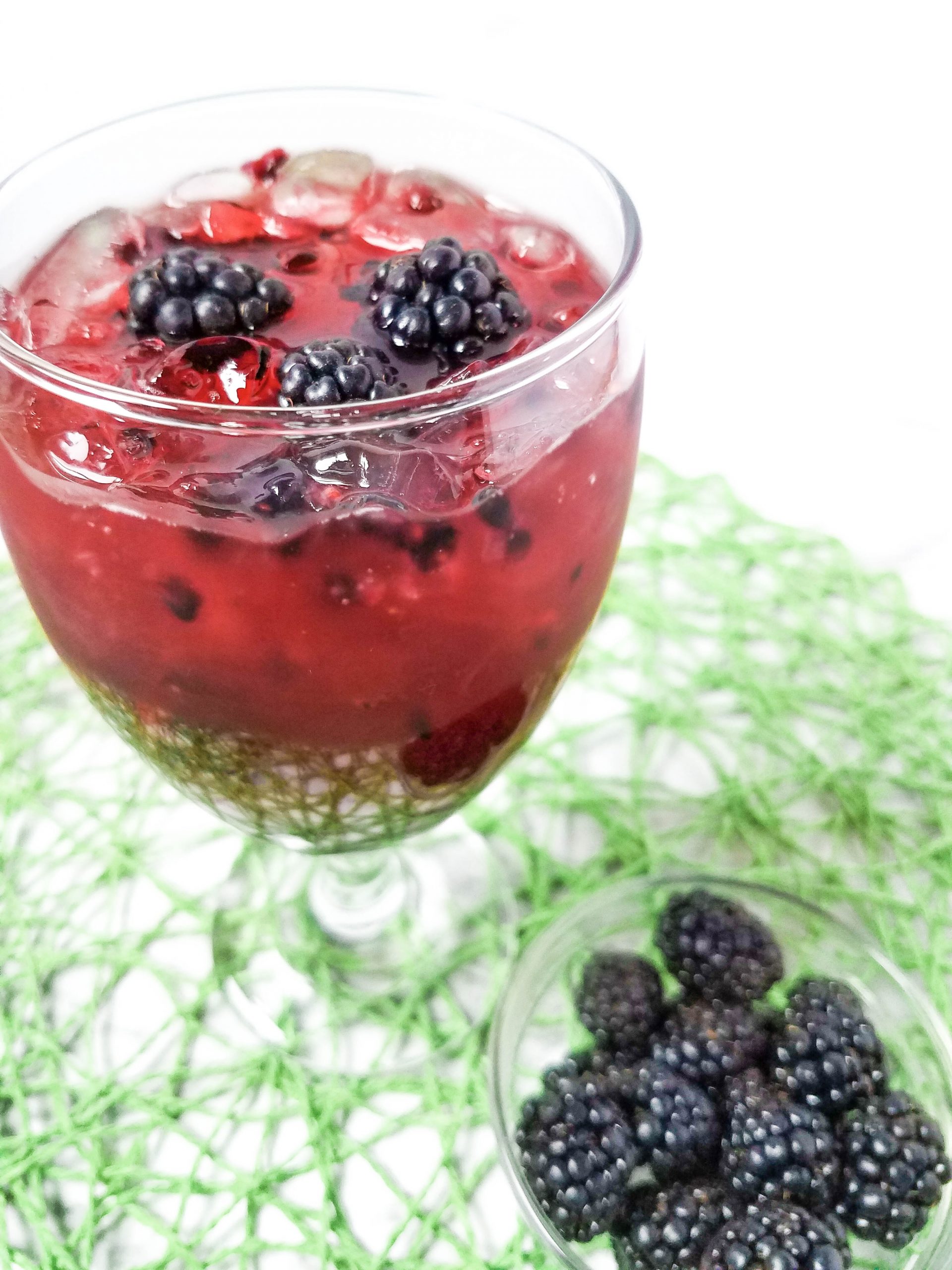 Blackberry Margaritias with blackberries on a green mat