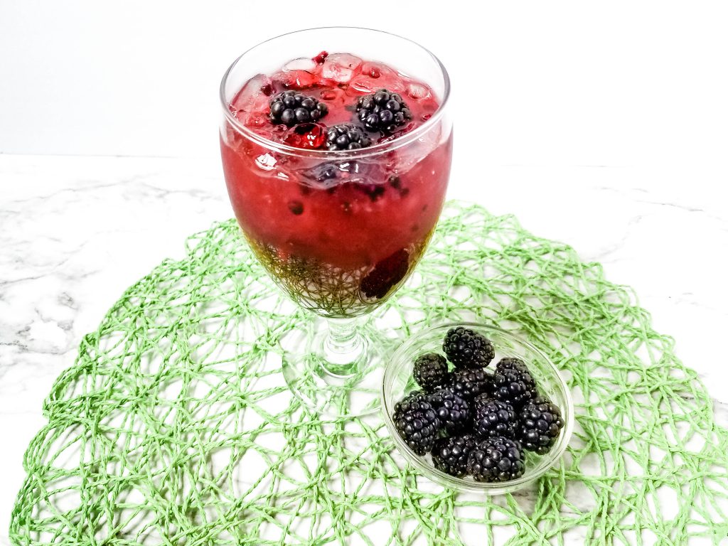 Blackberry Margaritias with blackberries on a green mat