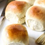 homemade rolls on a white surface